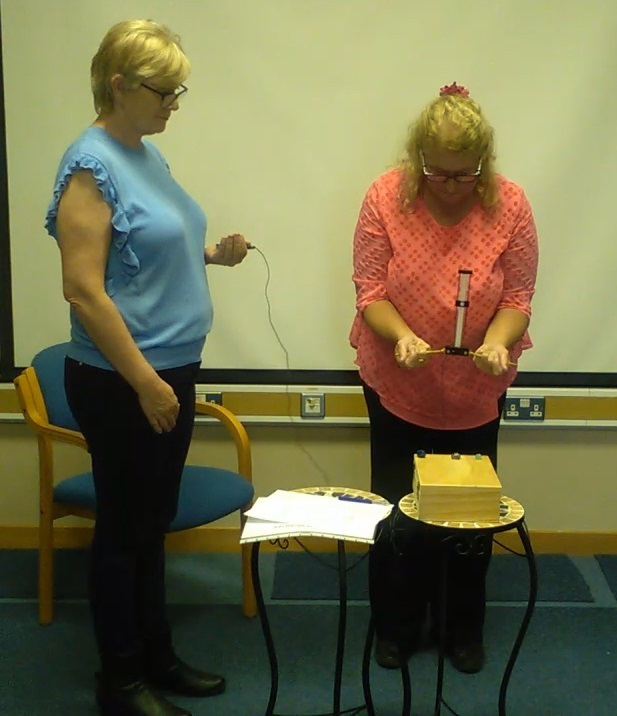 Anne-Marie demonstrating how to screen crystals with a Lecher Antenna Learn Dowsing